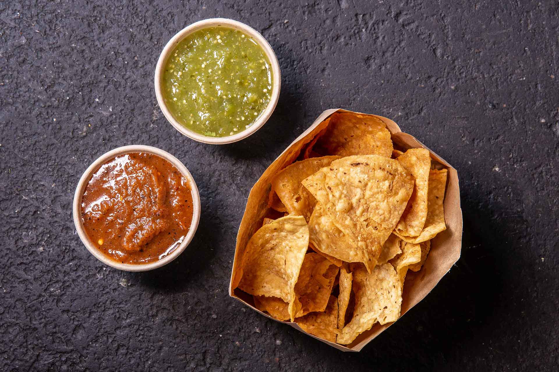 Chips and Salsa - Lightly salted tortilla chips with your choice of mild green or spicy red salsa.