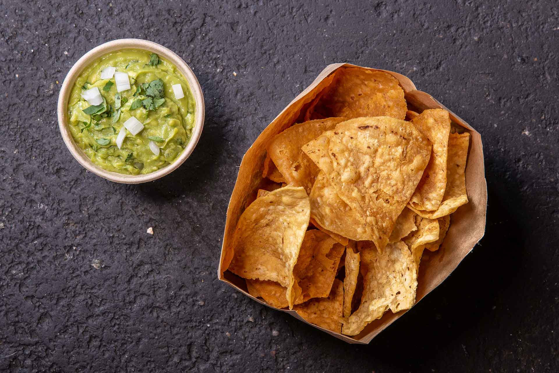 Chips and Guac - Lightly salted tortilla chips with our daily made guacamole.