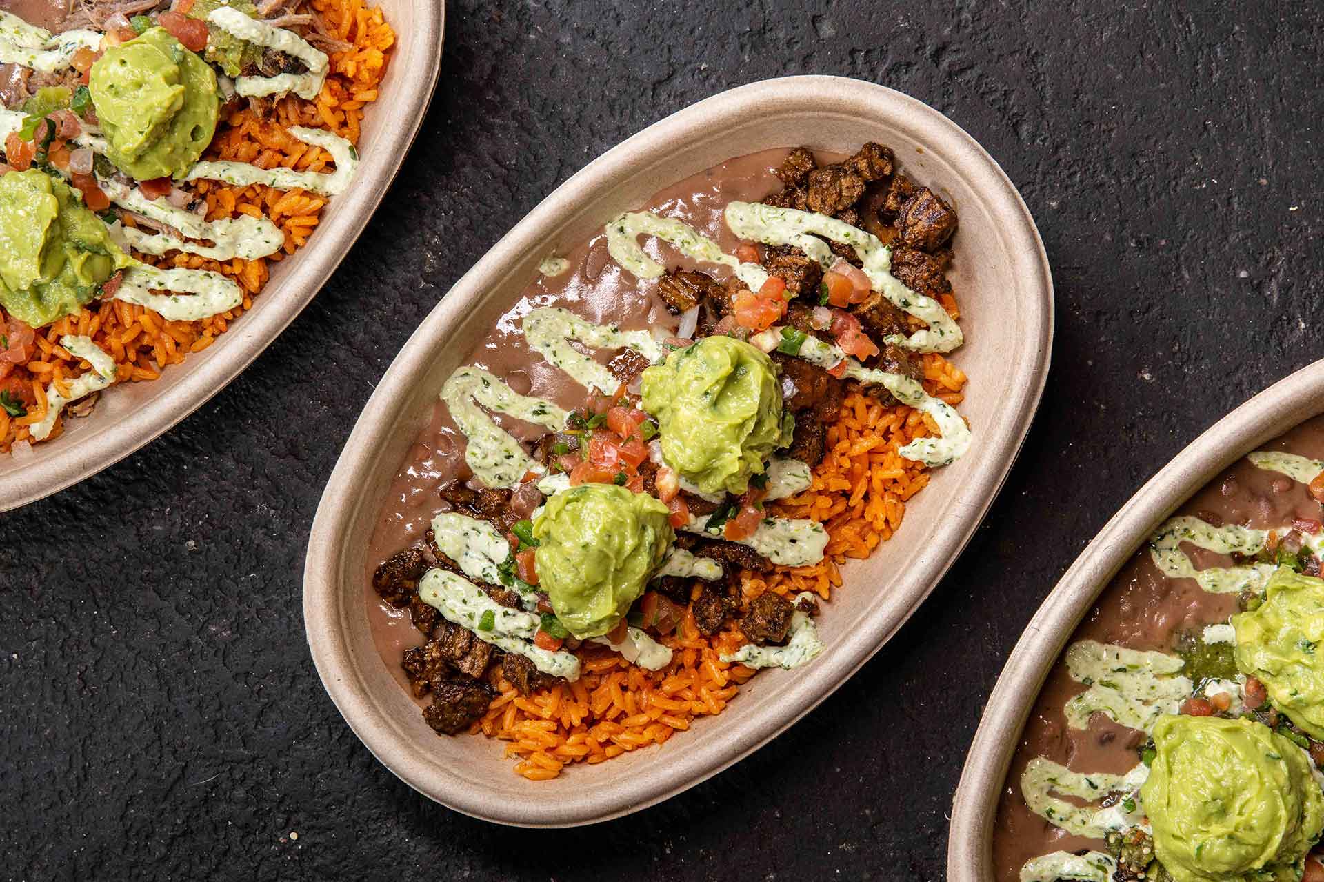 Taco Bowl - Rice and Beans with Pico de Gallo, Red Salsa, Serrano Crema, Guac, Cilantro, and Your Choice of Filling.